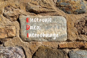 EDI electronic data interchange symbol. Concept words EDI electronic data interchange on big stone. Beautiful stone wall background. Business and EDI electronic data interchange concept. Copy space.