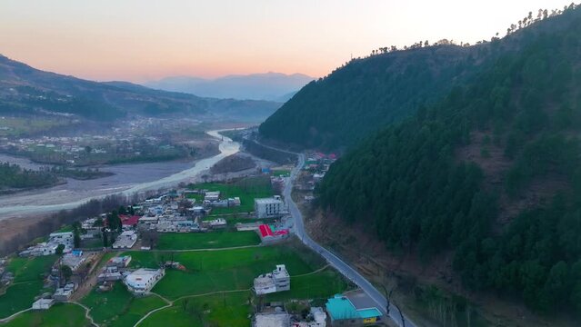 Aerial Morning Sunrise View Over Balakot Town In Mansehra district, Pakistan. Pull Back Shot