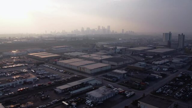 Aerial drone shot of downtown Calgary covered in wildfire smoke.