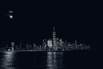 Naklejka premium an illuminated view of a city at night by the water