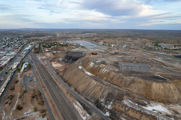 Aerial view of Broken Hill's Line of Lode abandoned mine and Miner's Memorial at sunset - NSW, Australia