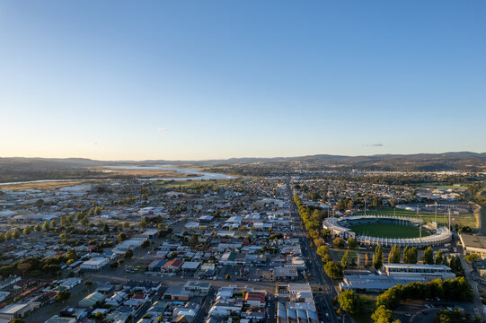 Aerial photo looking out over Launceston UTAS Stadium above the North Esk River at sunset with blue sky