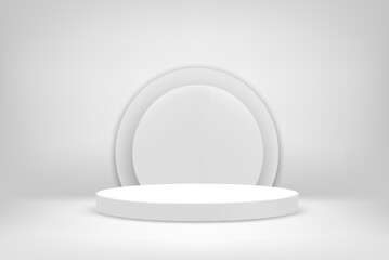 Bright white interior scene with round pedestal