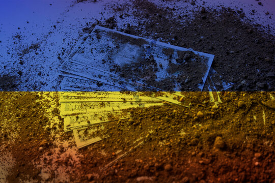 American dollars under the ground with Ukraine flag, dirty money in Ukraine concept, corruption 