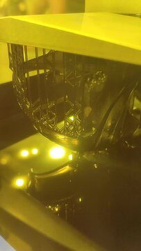 3D printer working process. 3D printing. Stereolithography photopolymerization SLA. Additive manufacturing technology. Liquid materials, hard part, creating layers. Ultraviolet polymerization Vertical