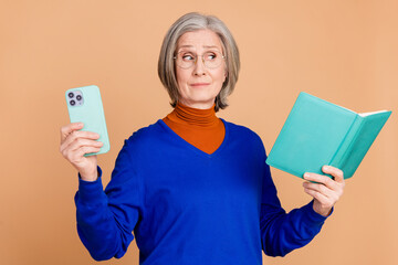 Photo portrait of attractive retired woman read book hold device dressed stylish blue clothes...