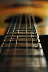 A close up of a guitar neck with the strings visible