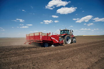 Riding, side view. Agricultural machinery, tractor on the field. Conception of harvest