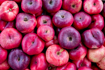 a pile of Paraguayan Peaches that are laying on a table