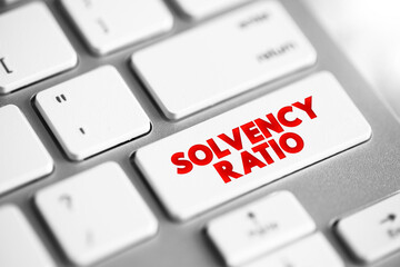 Solvency Ratio - relationship between equity and total assets, text concept button on keyboard