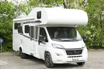 Family holidays in a motorhome, campervan holidays. Motorhome in the parking lot.