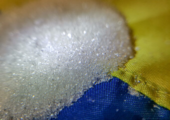 Ukrainian sugar scattered on the flag of Ukraine