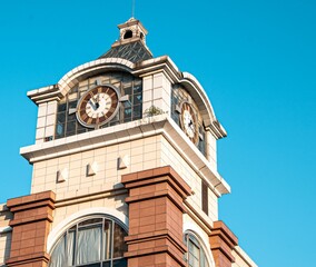 Large clock tower in a corner of a shopping mall in Wuhan.