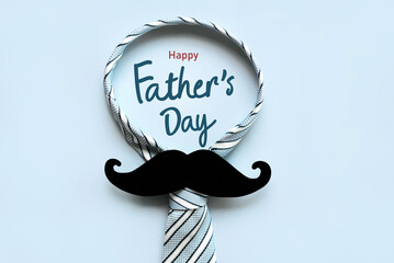 Happy Father's Day. Top view of necktie and false mustache with the text Happy Father's Day