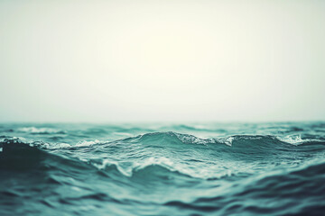 Photo of minimalistic light blue sea water with small waves in a pastel aesthetic style with simple neutral colors as an aesthetic background