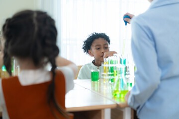 Teacher and students, Learn and experiment with science in a school science classroom.