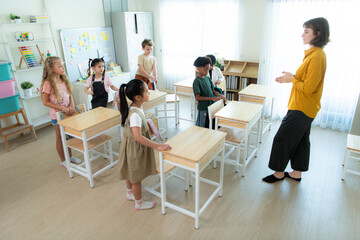 Teacher and students, In the morning to begin learning and studying in a classroom of school.