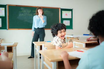 Students learn and study in a classroom of school where youngsters sit and play.