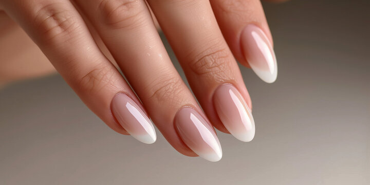 A woman's hands with long, painted nails