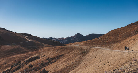 landscape of two hikers on the route