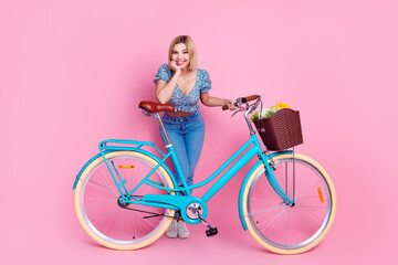 Full size photo of pretty young girl bike wear top isolated on pink color background