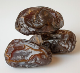 Fresh organic dried tasty dates background.  Top view on white backgrounds. Ramadan food. close up