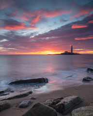 Sunrise over St Mary's Lighthouse and island at Whitley Bay on the north east coast of England, UK.