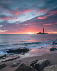 Sunrise over St Mary's Lighthouse and island at Whitley Bay on the north east coast of England, UK.