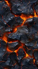 Close-up of a lava flow with orange and red glowing rocks. Volcanic eruption concept