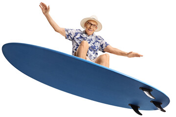 Elderly man riding a surfboard - Powered by Adobe