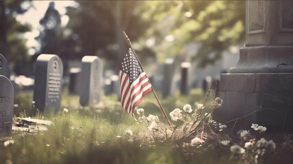 American flag on a grave in the cemetery. Selective focus.