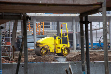 Powerful construction compactor at work, shaping the foundation with precision. Essential equipment for building projects.