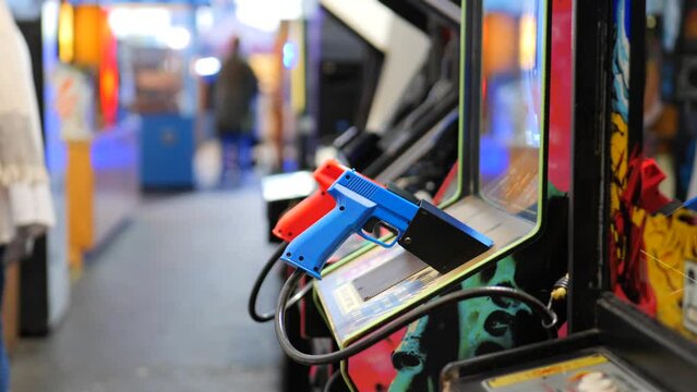 Pistol hand gun retro video game machine in an arcade 
