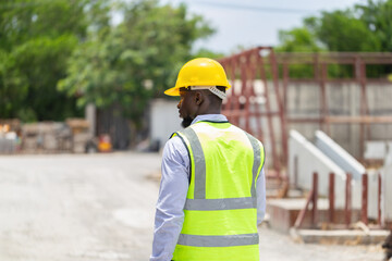 Engineer man in hardhats on construction site, Foreman checking project at the precast concrete...