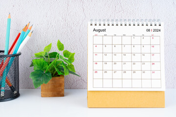 August 2024 Desk Calendar with pencil.
