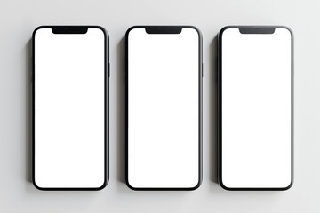 Flat lay of three smartphones with white blank screens mockup on white background. Top view of three smartphones business infographic mockups of web site or design app.