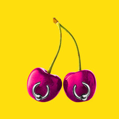 Two cherries with piercings against bright yellow background. Contemporary art collage. Concept of summertime, surrealism, abstract creative design, pop art