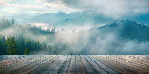 View from the empty wooden terrace over the mountains and forest in summer morning fog. Nature...