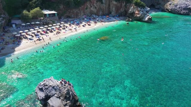 Aerial view of the beautiful beach with emerald and turquoise sea of Milopotamos, Mouresi, North Pelion Coast, Greece