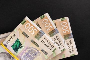 bundles of hryvnia on a black background. Ukrainian money. 500 hryvnia banknotes. A lot of Ukrainian money.