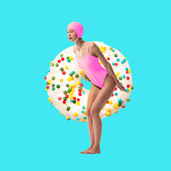 Woman in pink swimsuit and swim cap standing with donut covered in colorful sprinkles. Swimming items. Contemporary art collage. Concept of summertime, surrealism, abstract creative design, pop art