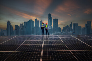 Engineers working on solar cell plant with city scape background .Solar cell grid ecology is clean...