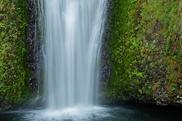 Fototapeta premium Summer landscape of Lower Multnomah Falls captured with motion blur, Columbia River Gorge, Oregon, USA