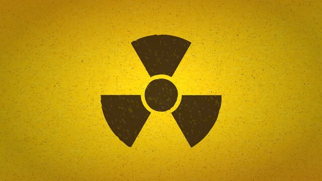 Appearance of the damaged radiation symbol on a yellow screen background