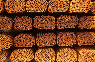 Stacked packs of stored rusty fittings in a warehouse.