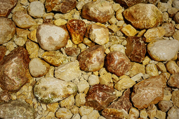 Stones by the mountain river. Heated by the sun and cracked. Ecologically clean places