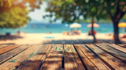 Empty wooden table top for product display, presentation stage. Tropical summer, palm trees, beach bar, white sand and blue ocean in the background. 