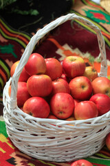 Red apples in white basket