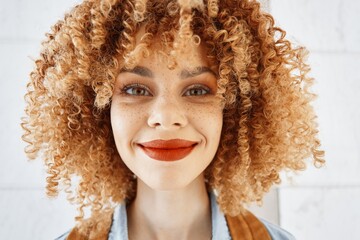 Joyful Curly-Haired Woman with Goggles, Smiling in Fashionable Eyewear, Enjoying Modern Lifestyle