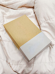 Paper cardboard food box on the bed top view 